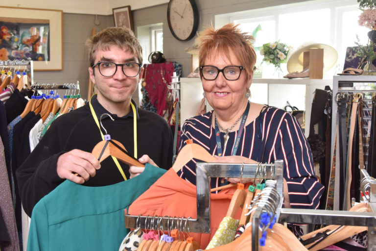 two people in a clothes shop