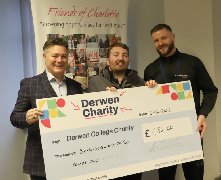 Hartey Wealth Management chairman Karl, student Brendan and Derwen College sports coordinator Steve stand in a group holding a giant Derwen Charity cheque for £682. They are stood in front of a banner which says 'Friends of Charlotte - providing opportunities for the future'.